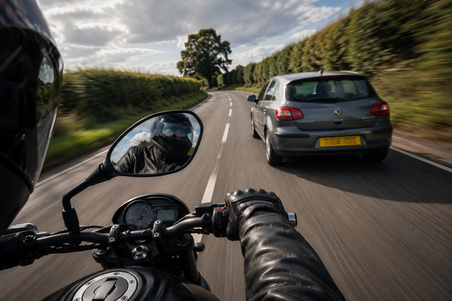 picture depicting a motorcyclist checking over there shoulder