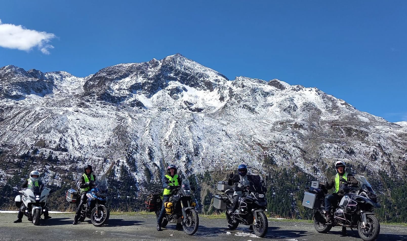 Picture of Tip Top Tours on their bike in front of some mountains