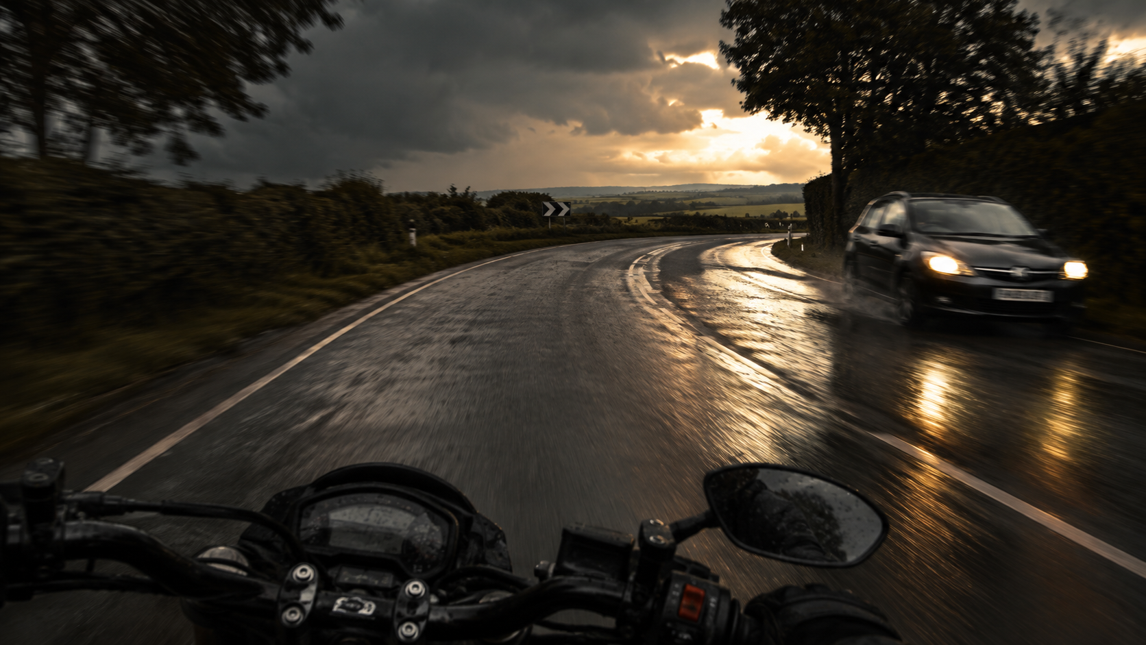 A motorcyclist riding in the rain